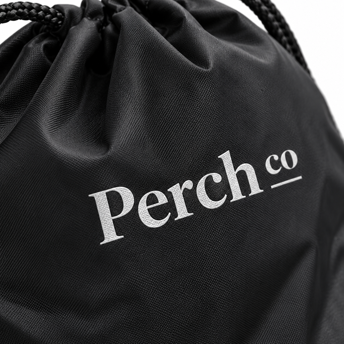 Close-up of the printed logo on the drawstring bag