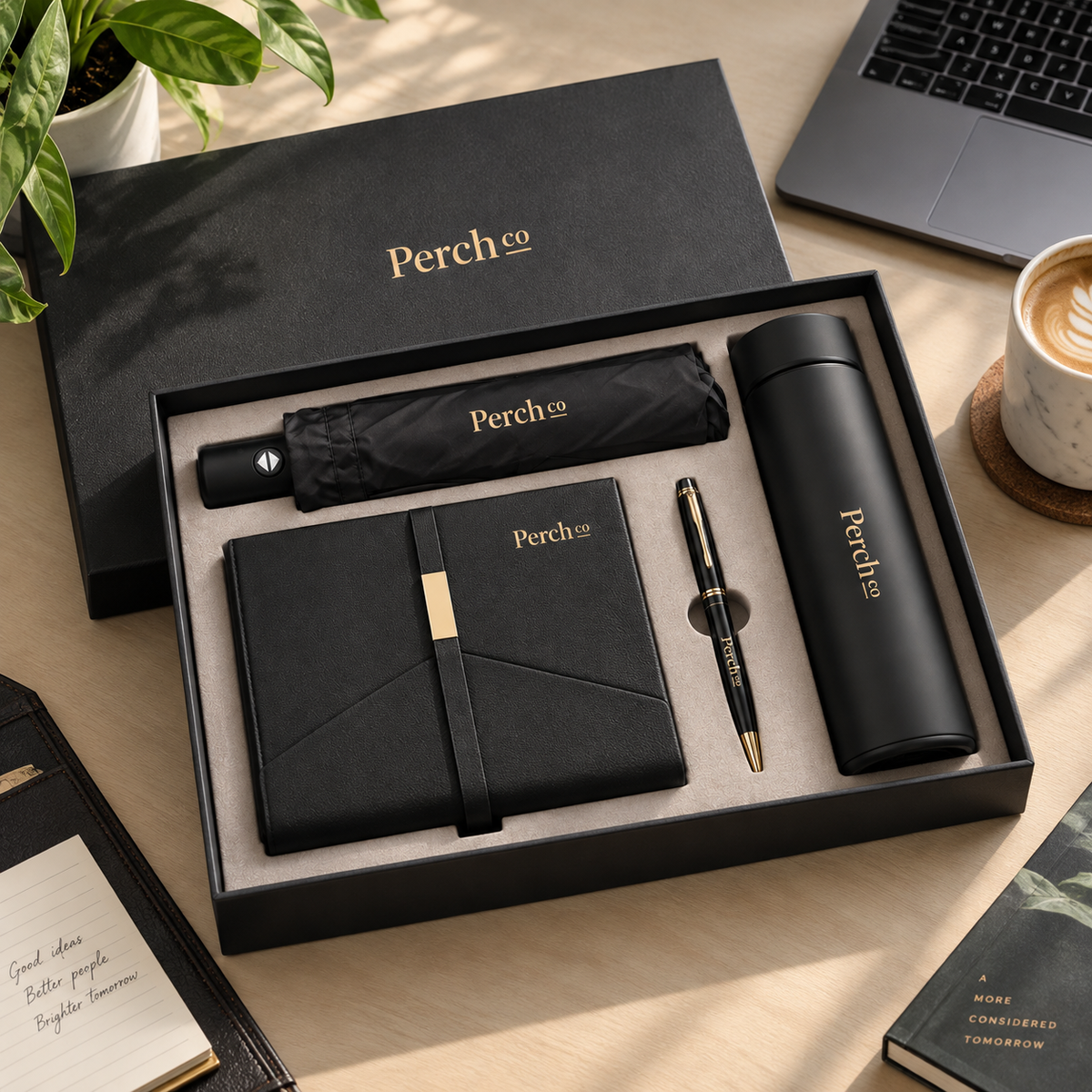 Four-Piece Umbrella Gift Set in an open black gift box with umbrella, notebook, pen and insulated bottle