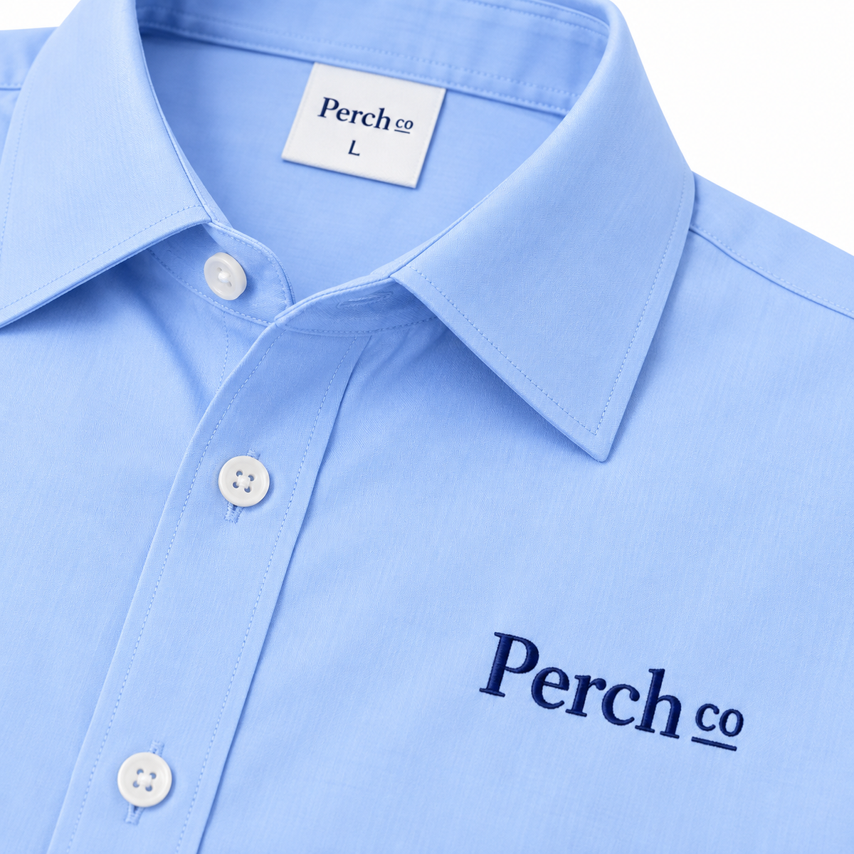 Close-up of the collar and embroidered logo on the work shirt