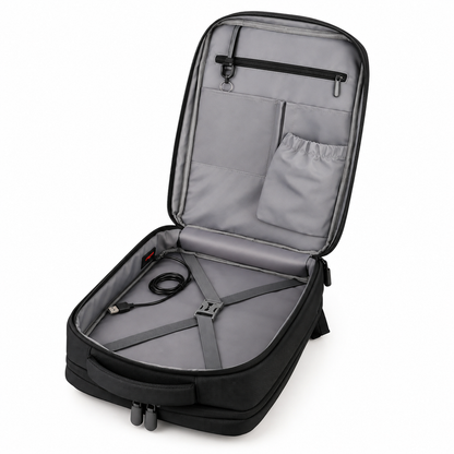 Flat-opening backpack unzipped 180 degrees showing interior pockets and cross straps