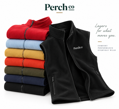 Folded stack of bonded fleece vests in seven colours