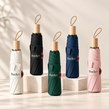 Wooden-handle folding umbrellas in cream, black, dark green, navy and pink