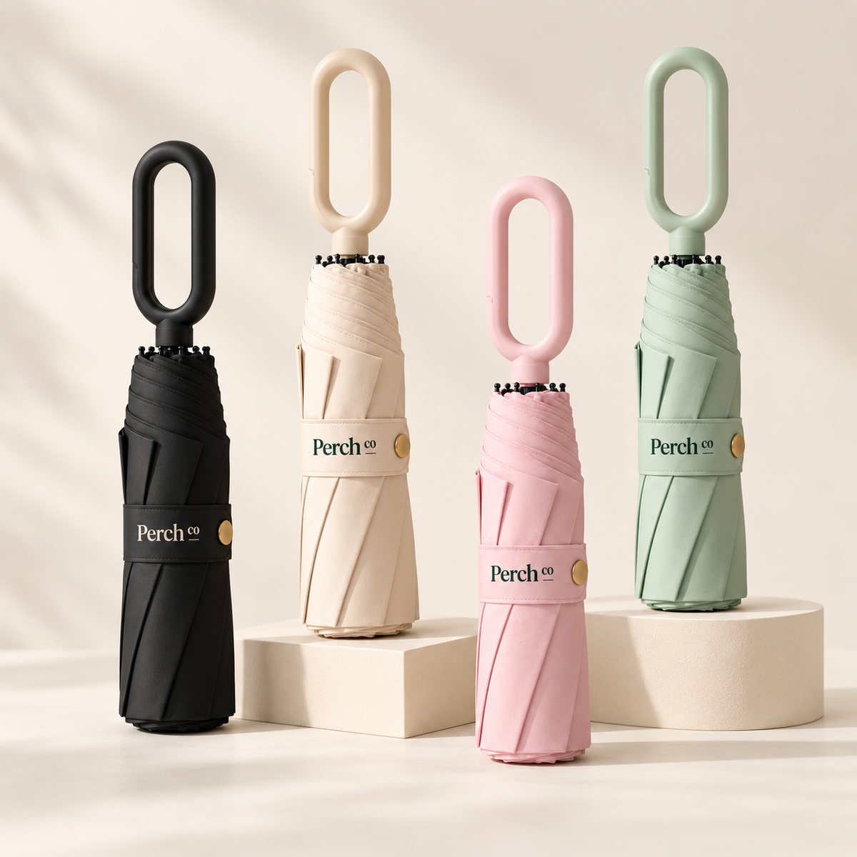Loop-handle automatic umbrellas in black, cream, pink and sage green