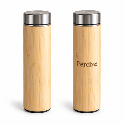 Two Perch Co branded slim bamboo flasks showing the natural grain variation