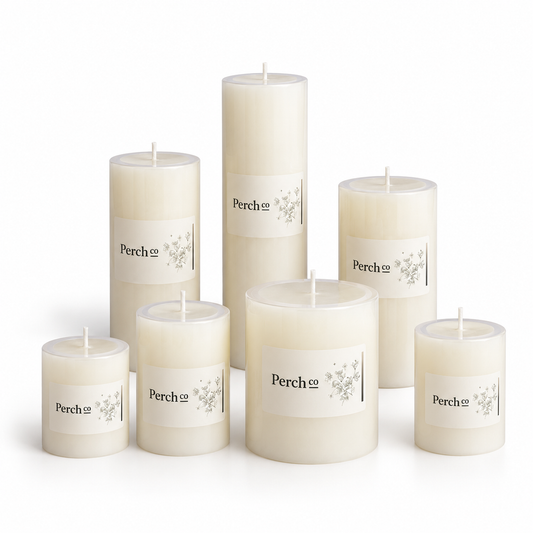 All seven pillar candle sizes together, from 5 x 5 cm to 7 x 15 cm, each with a branded wrap label