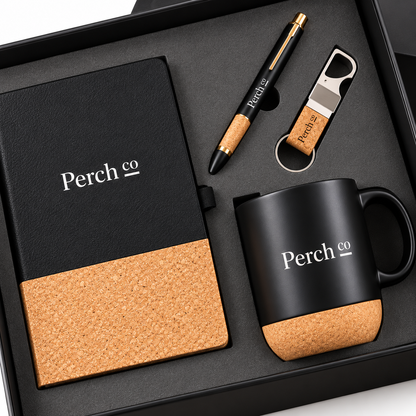 Close view of the cork detailing on the branded notebook, pen, keyring and mug