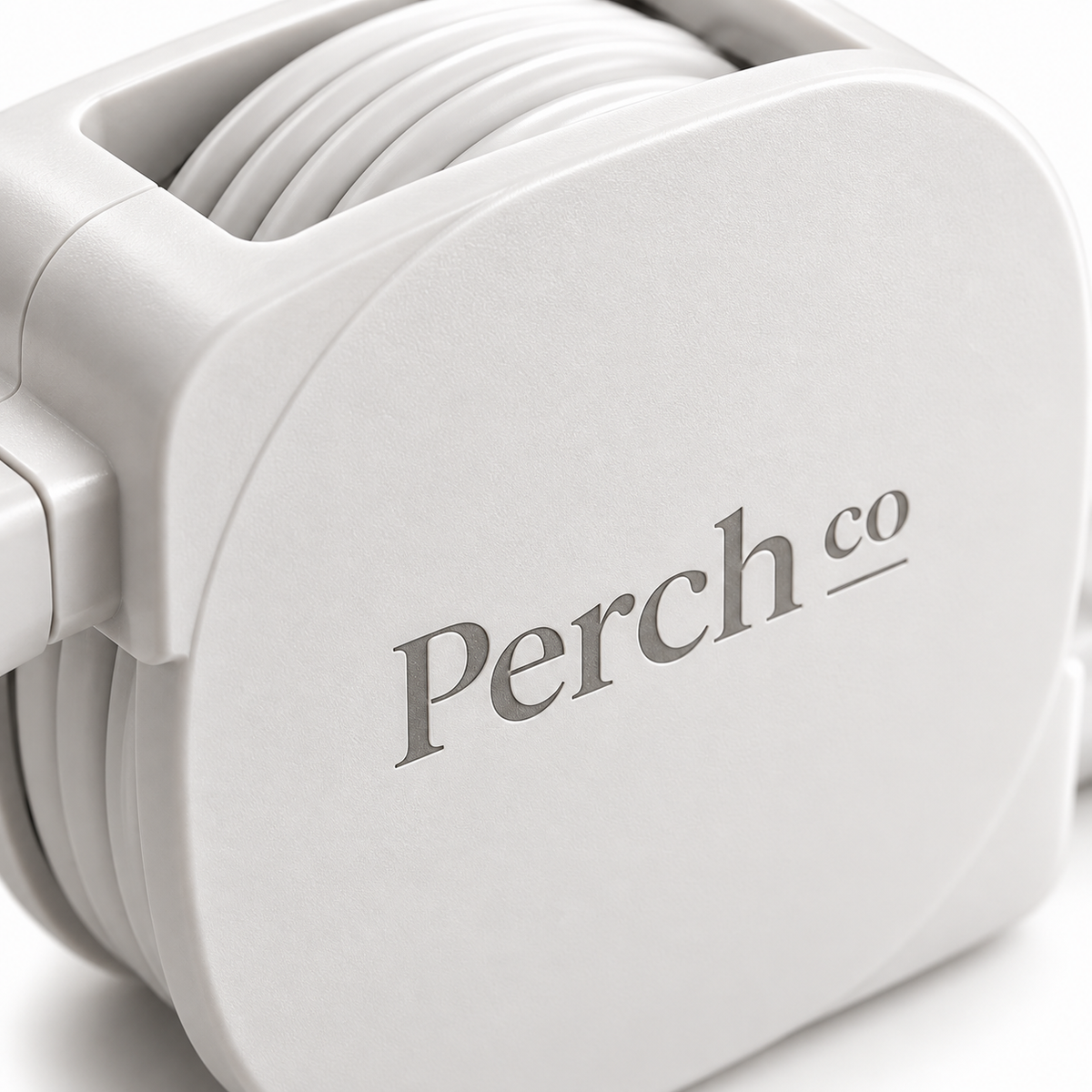 Close-up of the printed logo on the white charging cable housing