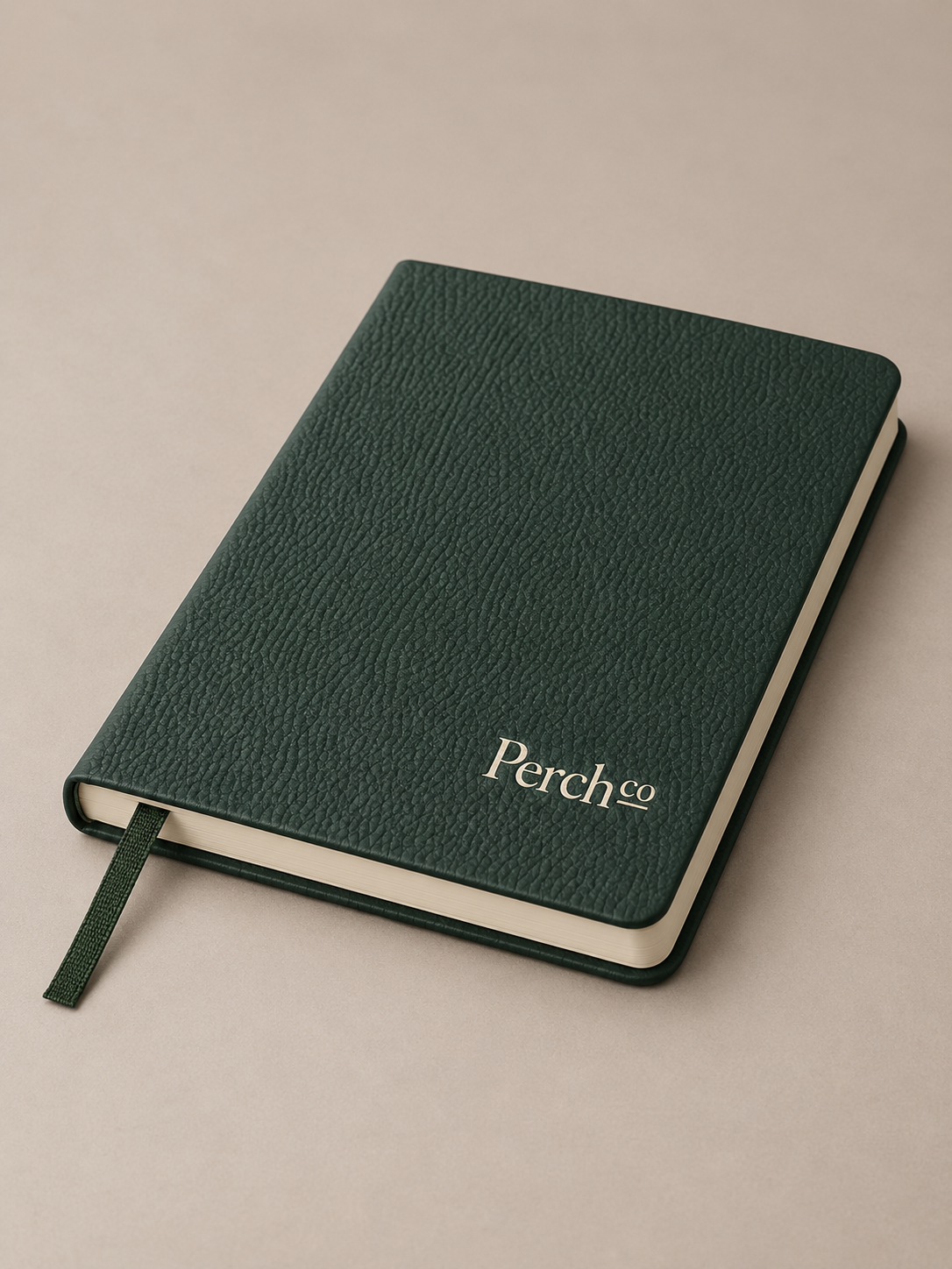 Dark green A5 softcover notebook with ribbon marker and printed logo